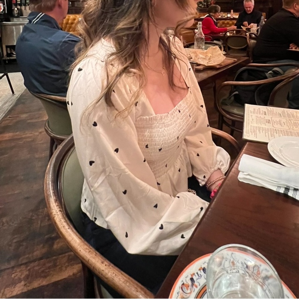 Cream top with black hearts Size medium